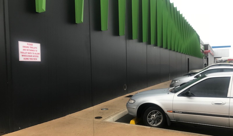 the walkway doesn't allow wheelchairs to get past trolleys