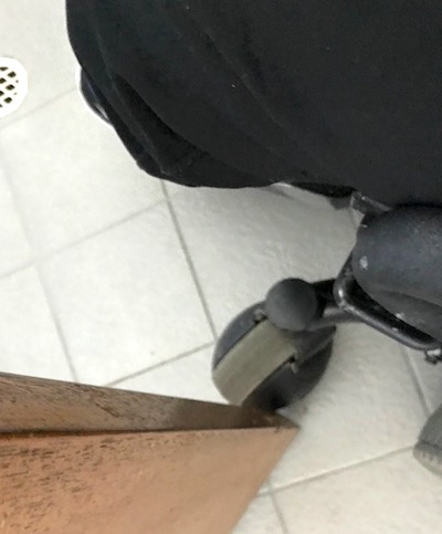 the wooden door is wedged against my wheel