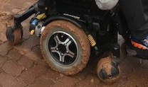 mud is coated on all 3 wheels of my powered wheelchair - RAA wheelchair road service