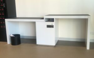 inside the PO - two tables and one is higher to allow wheelchairs to be parked underneath