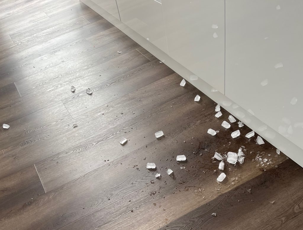 brown timber look floor, with 20 ice cubes on it