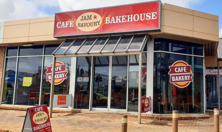 a a frame sign out the front, a huge sign above the door, lots of glass windows, and a double door. It is the cafe bakehouse. Sefton Plaza Accessibility