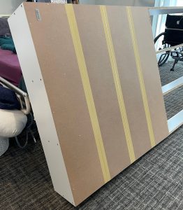 first backing is on the back of the bookcase