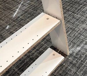 the 2 bottom shelves needed adjusting as they came off